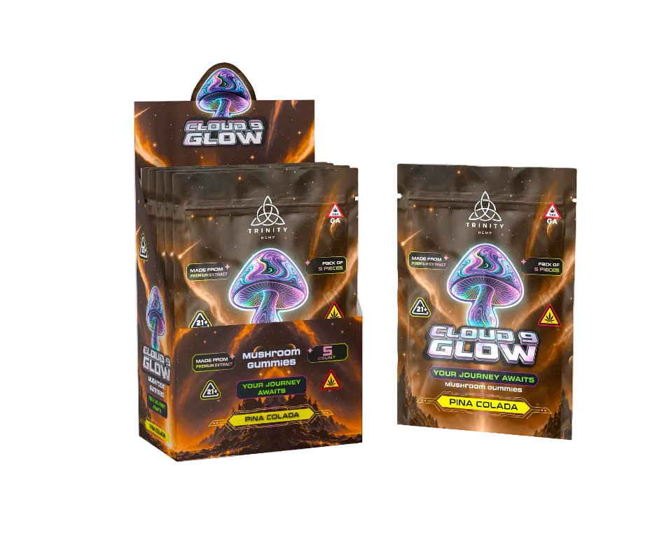 A retail display box and a single packet of Trinity Brand Cloud's Glow Mushroom Buds in the Pine Colada flavor