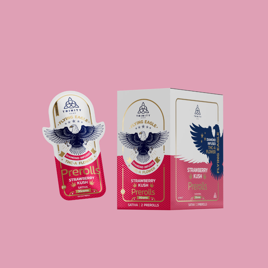 Trinity Flying Eagles Strawberry Kush pre-rolls packaging on a pink background